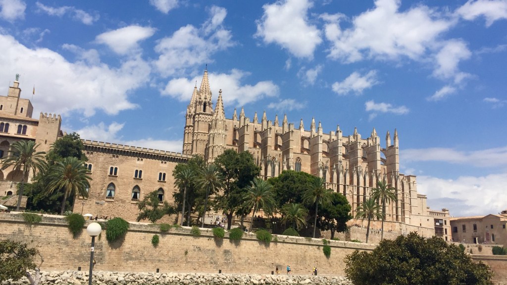 Palma Cathedral and the Almudaina palace across the still water of the Parc de la Mar