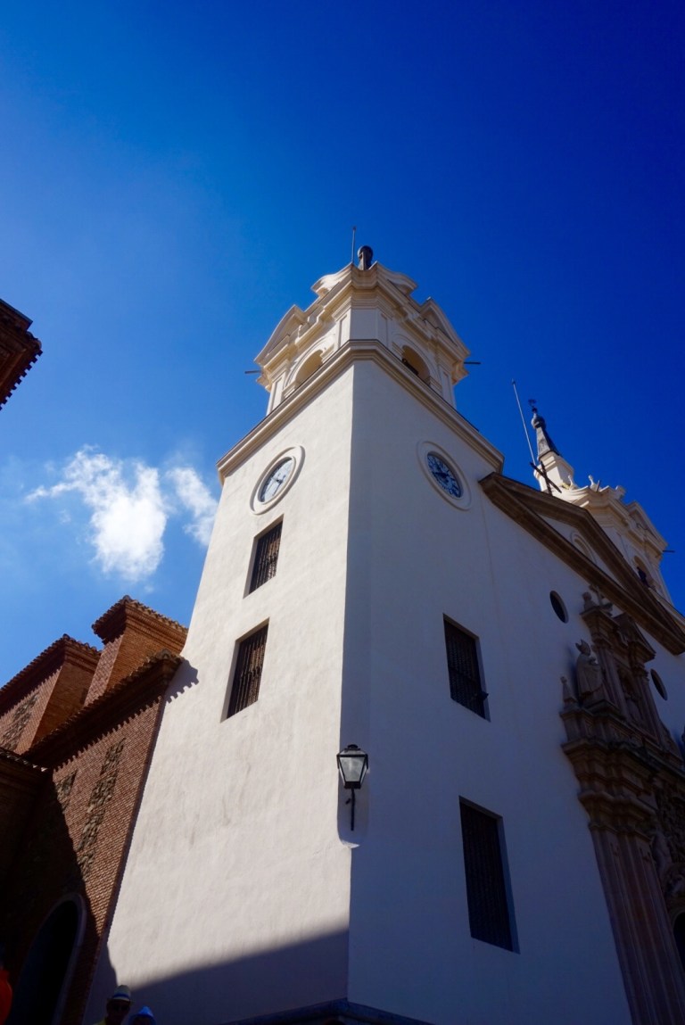 The shrine's white bell tower against a clear blue sky