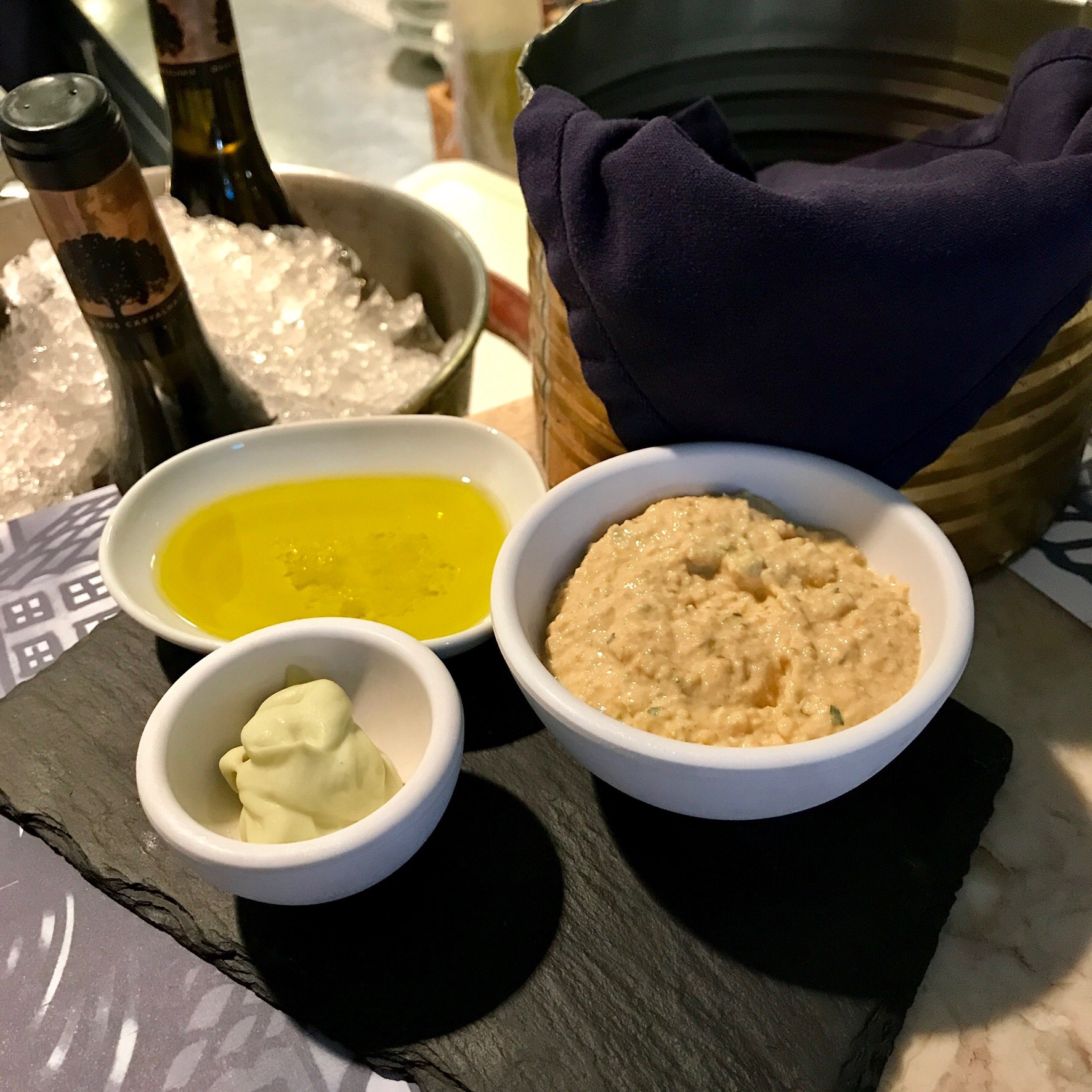 Bread and a dish of olive oil set out on the table at dinner in Lisbon