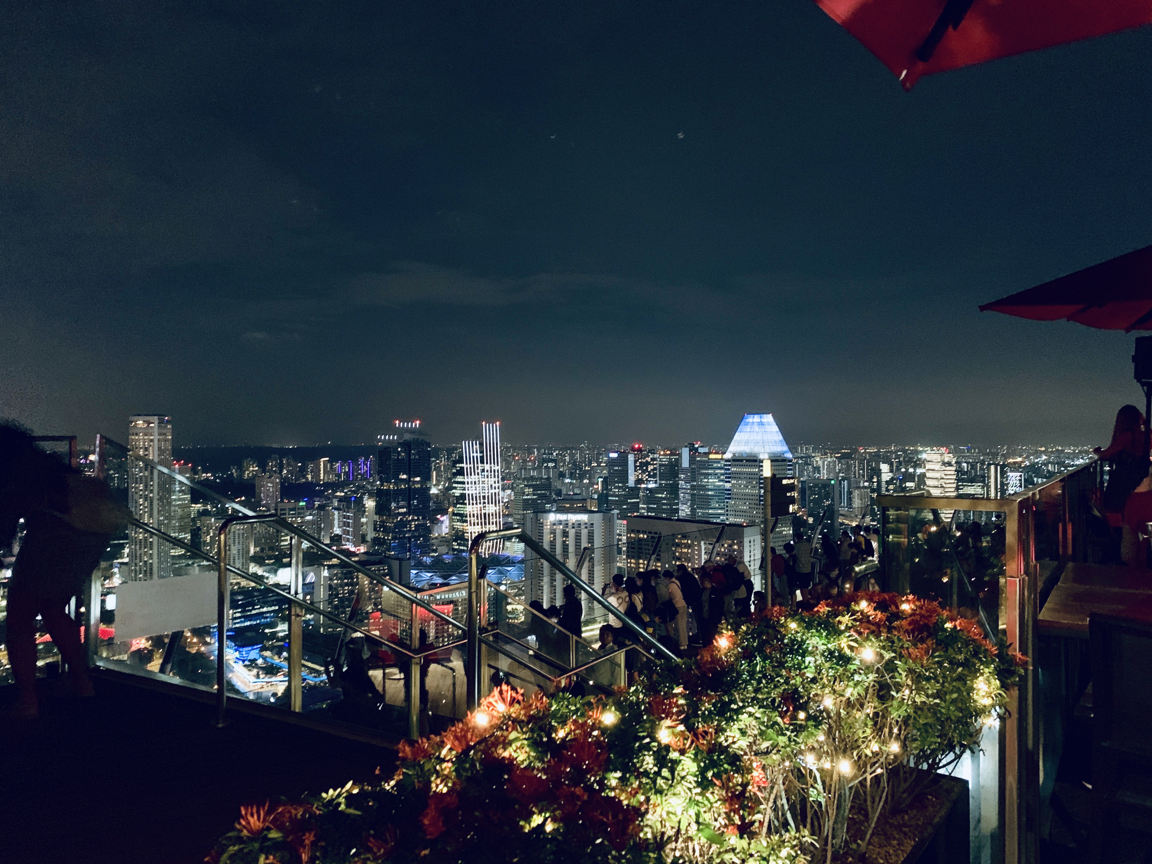Singapore lit up at night, seen from a rooftop