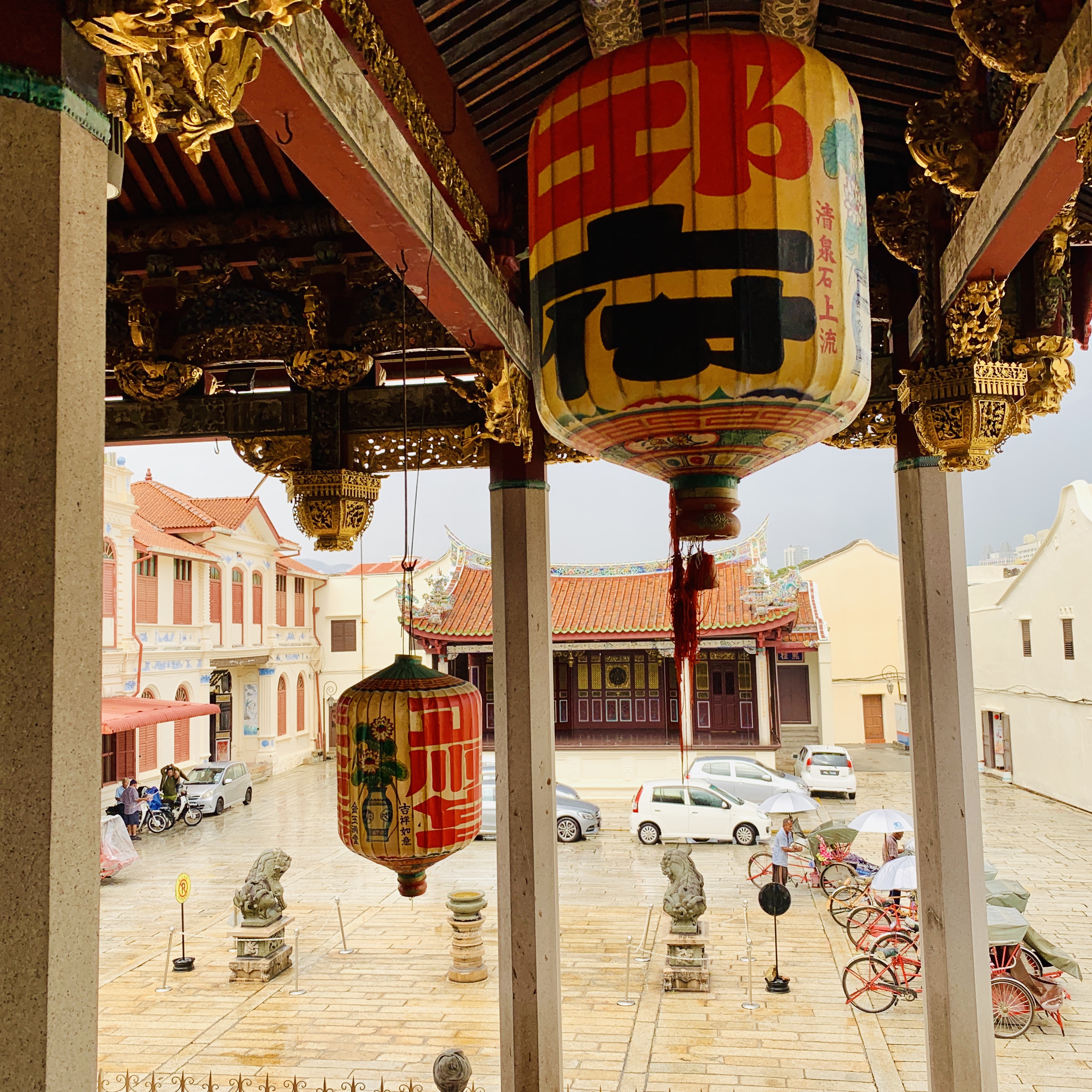 Looking out from inside the temple, between the columns, onto the street