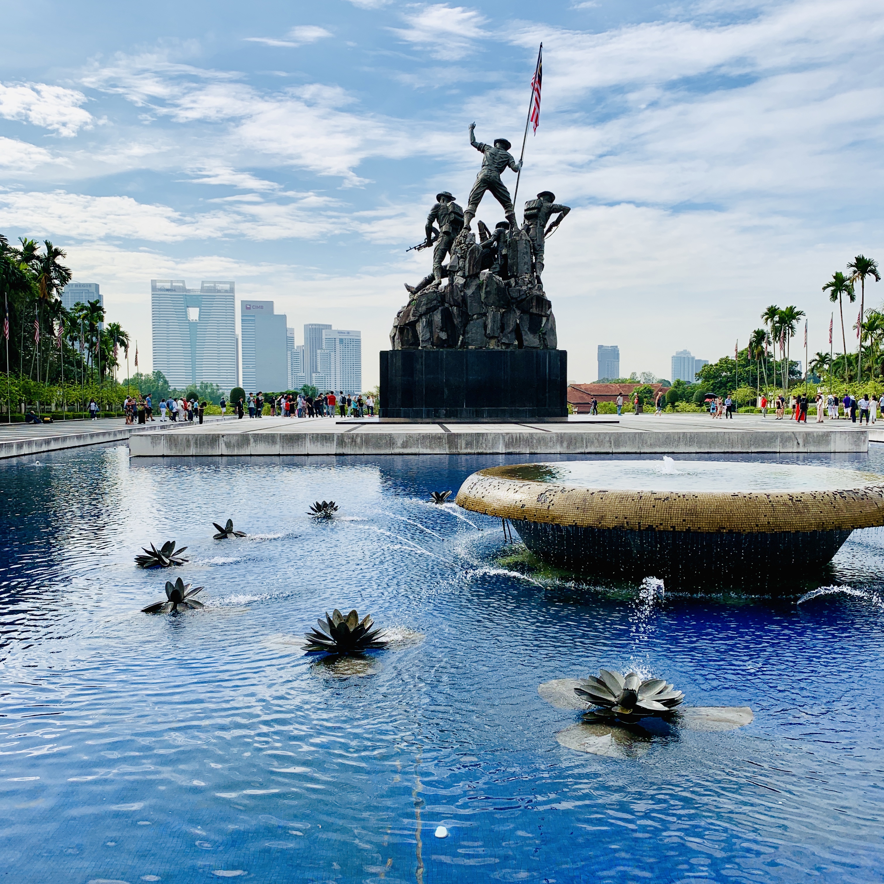 The National Monument in Kuala Lumpur, the bronze figures standing above their reflecting pool