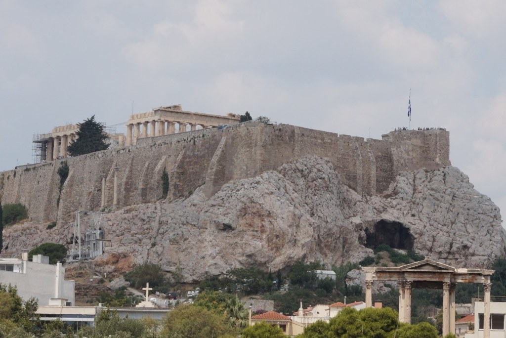 The Acropolis rock with the Parthenon on top, and Hadrian's Arch standing at the lower right