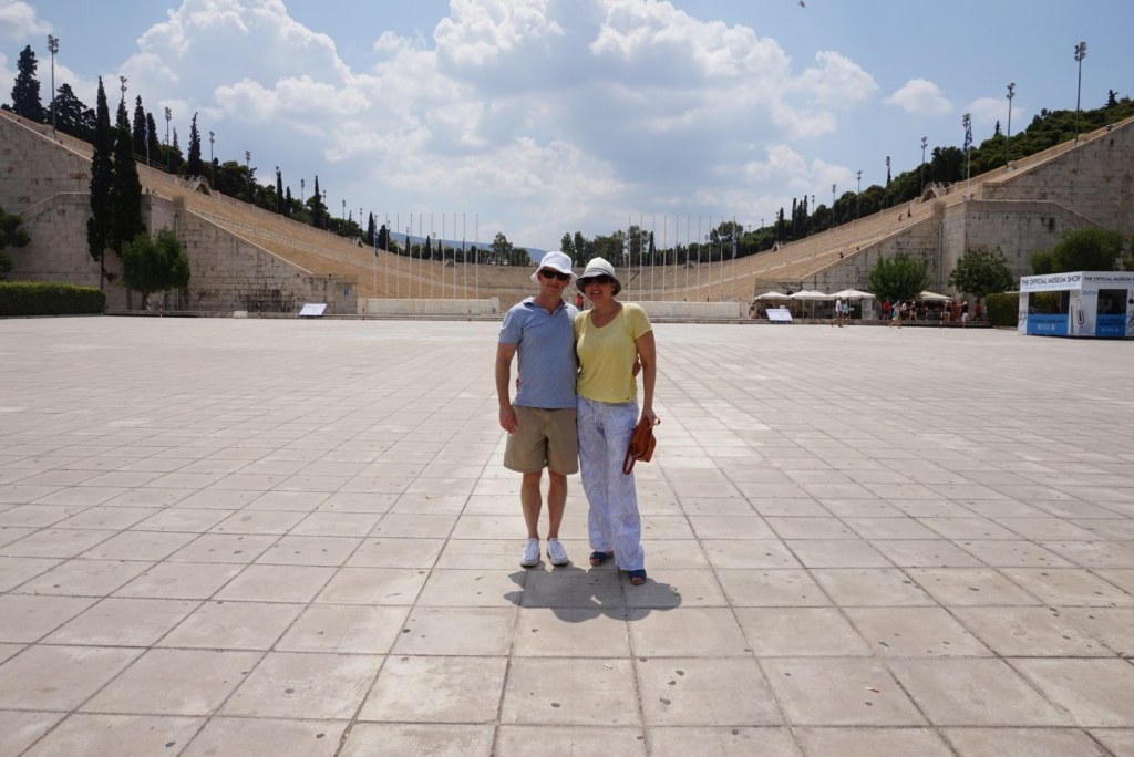 Chris and Jen alone in the middle of the marble horseshoe of the Panathenaic Stadium