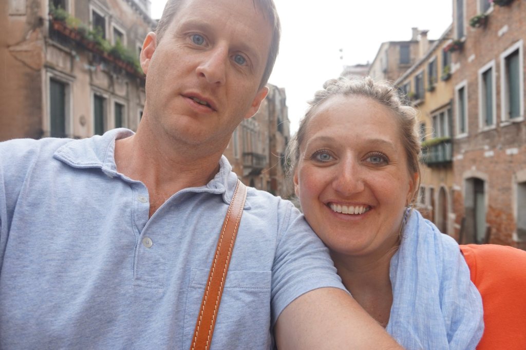 Chris and Jen in a narrow Venetian calle with shuttered windows above them
