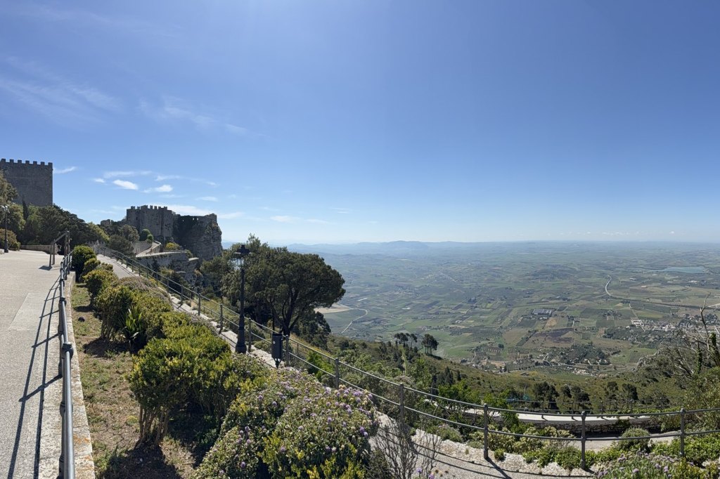 A sweeping view from the battlements of Erice’s hilltop castle over Sicily’s coastal plain toward Trapani.
